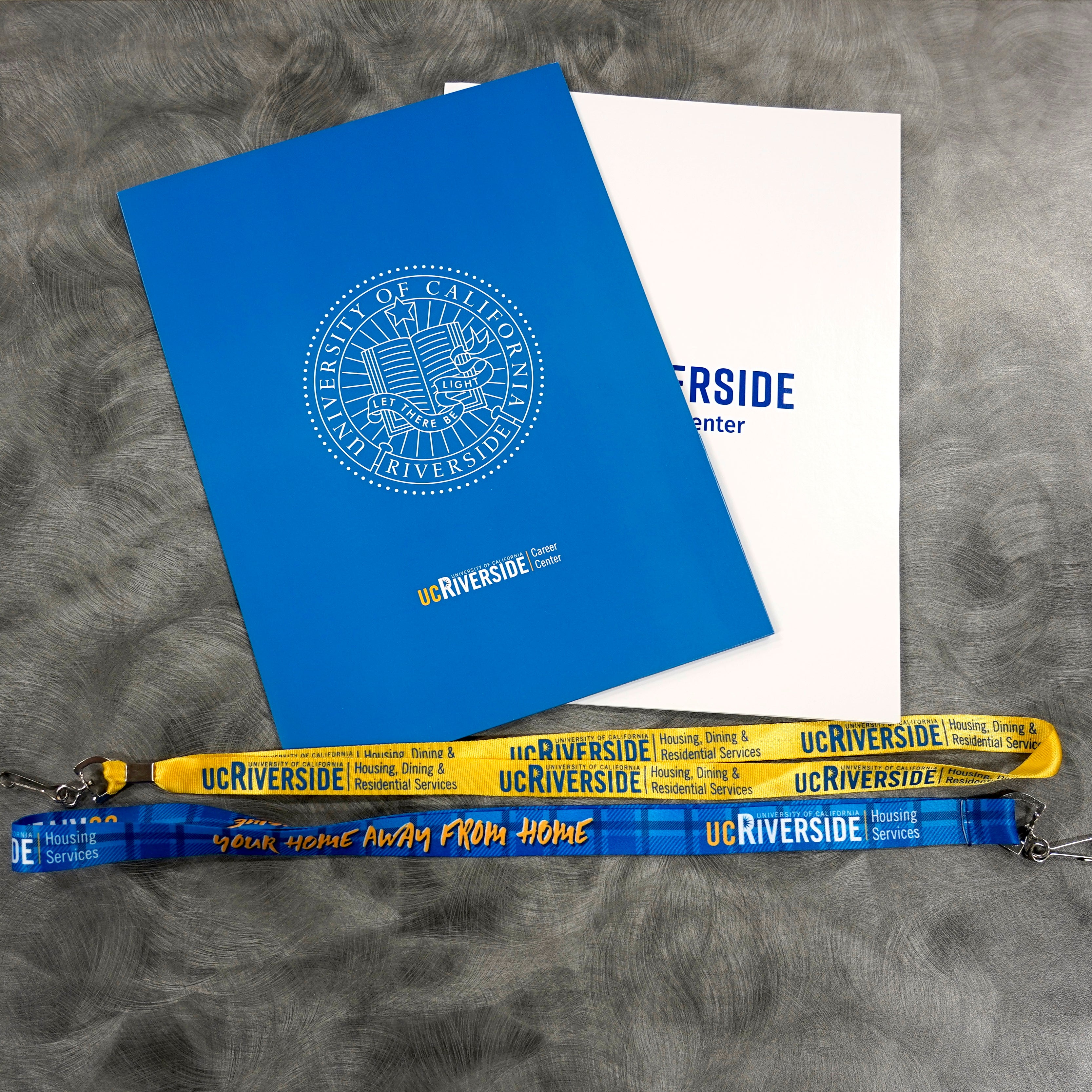 Summer spend hitting you hard? No worries. These lanyards and folders are 100% free.
