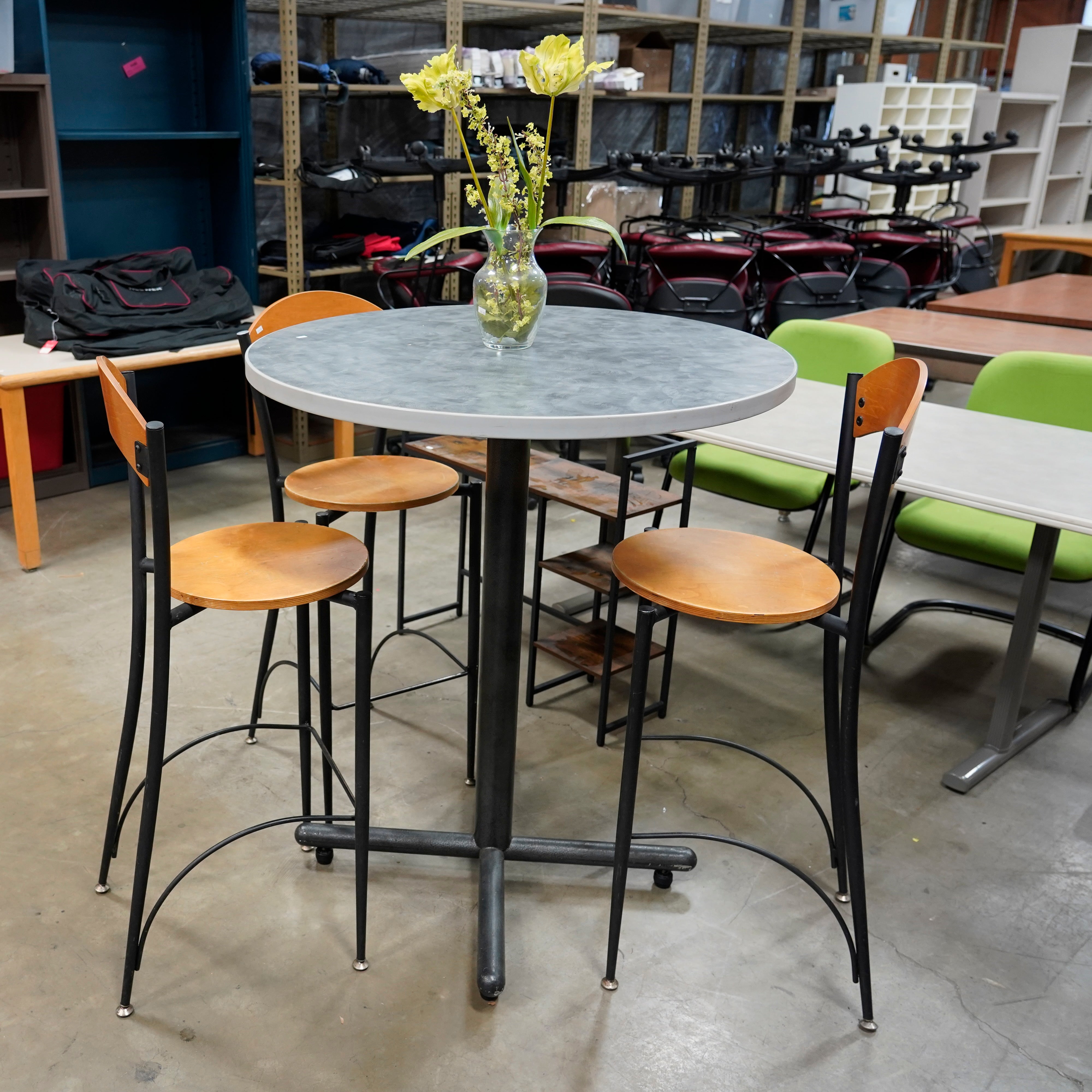 A high-top table and three high-top chairs to up your seating game.