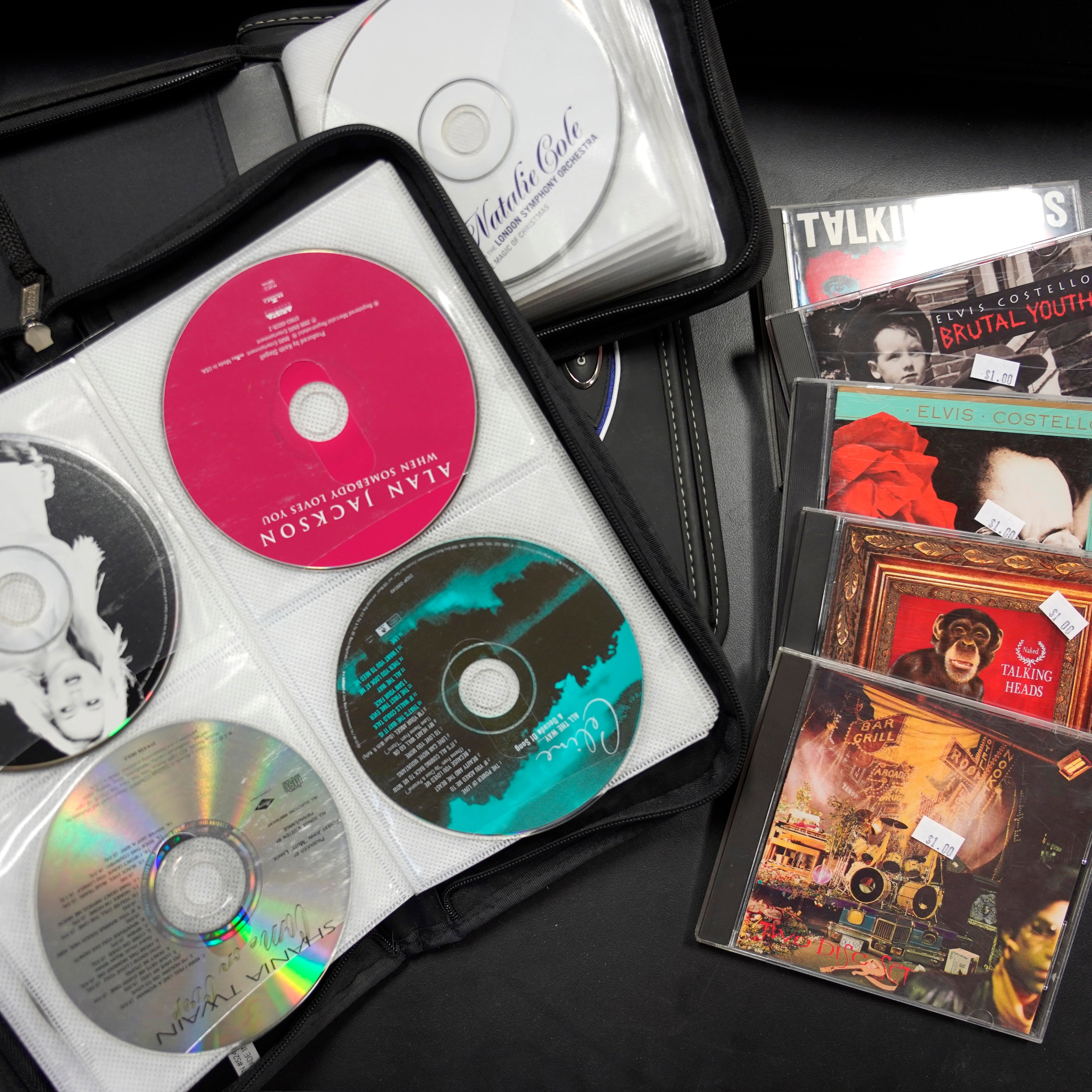 A wide selection of CDs for curating the perfect ambiance.