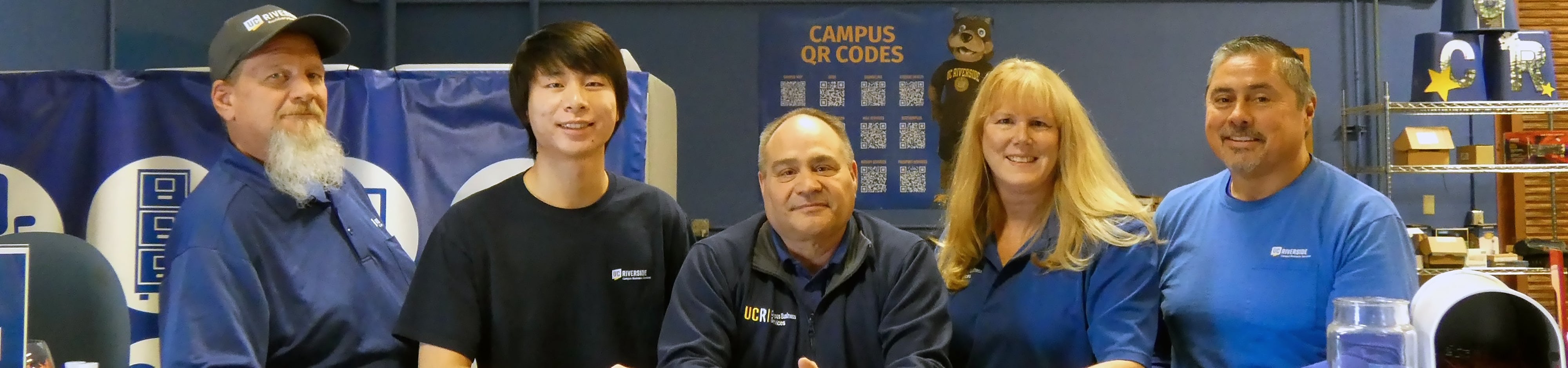 The ScotSurplus team stands together.