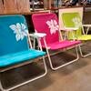 Bright blue, pink, and green kid-sized beach chairs
