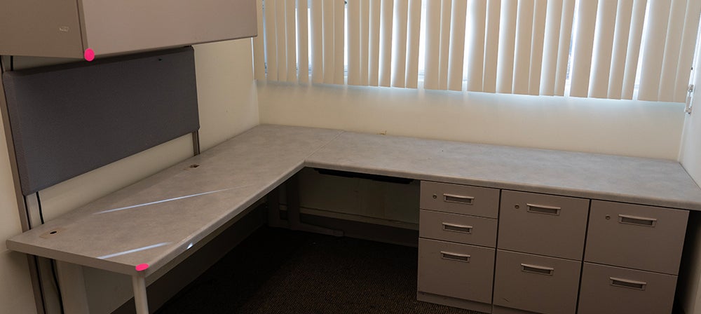 large L-shaped desk with upper cabinets