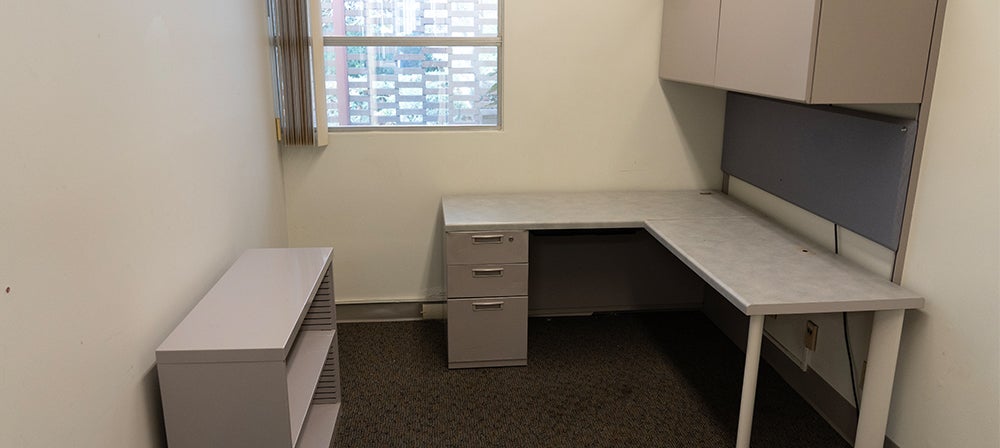 L-shaped desk with upper cabinets and filing cabinet