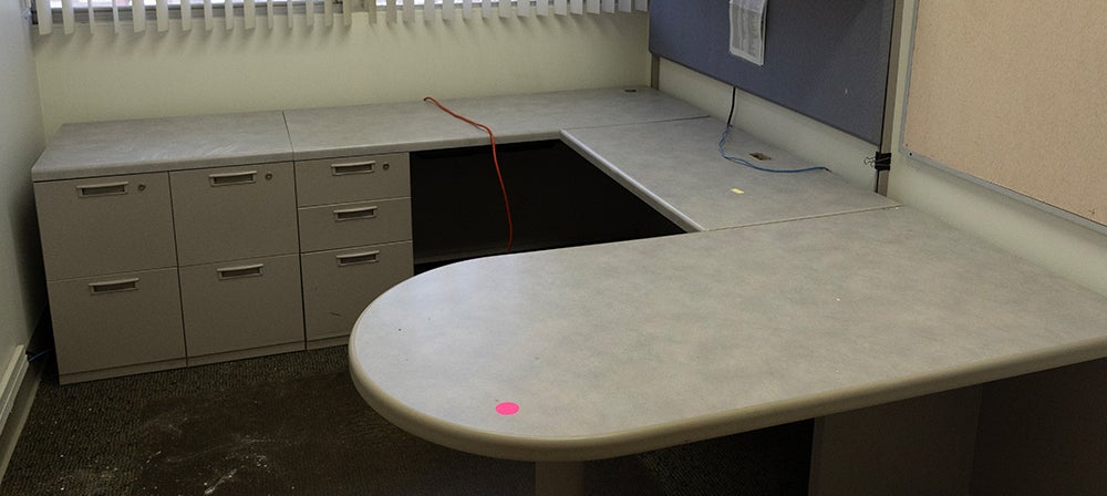 L-shaped desk with rounded edges with upper cabinets